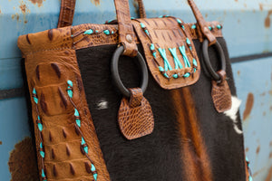 The Horn Peak Collection is a distinctively handcrafted luxury tote bag of genuine leather and cowhide which embodies the lifestyle of the iconic West