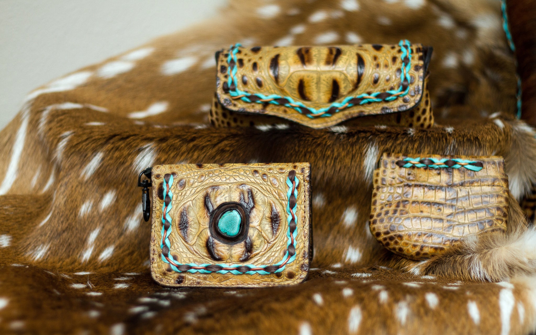 Leather wallet, sunglasses case and earbud holder is a distinctively handcrafted luxury accessory collection of genuine leather and cowhide which embodies the lifestyle of the iconic West