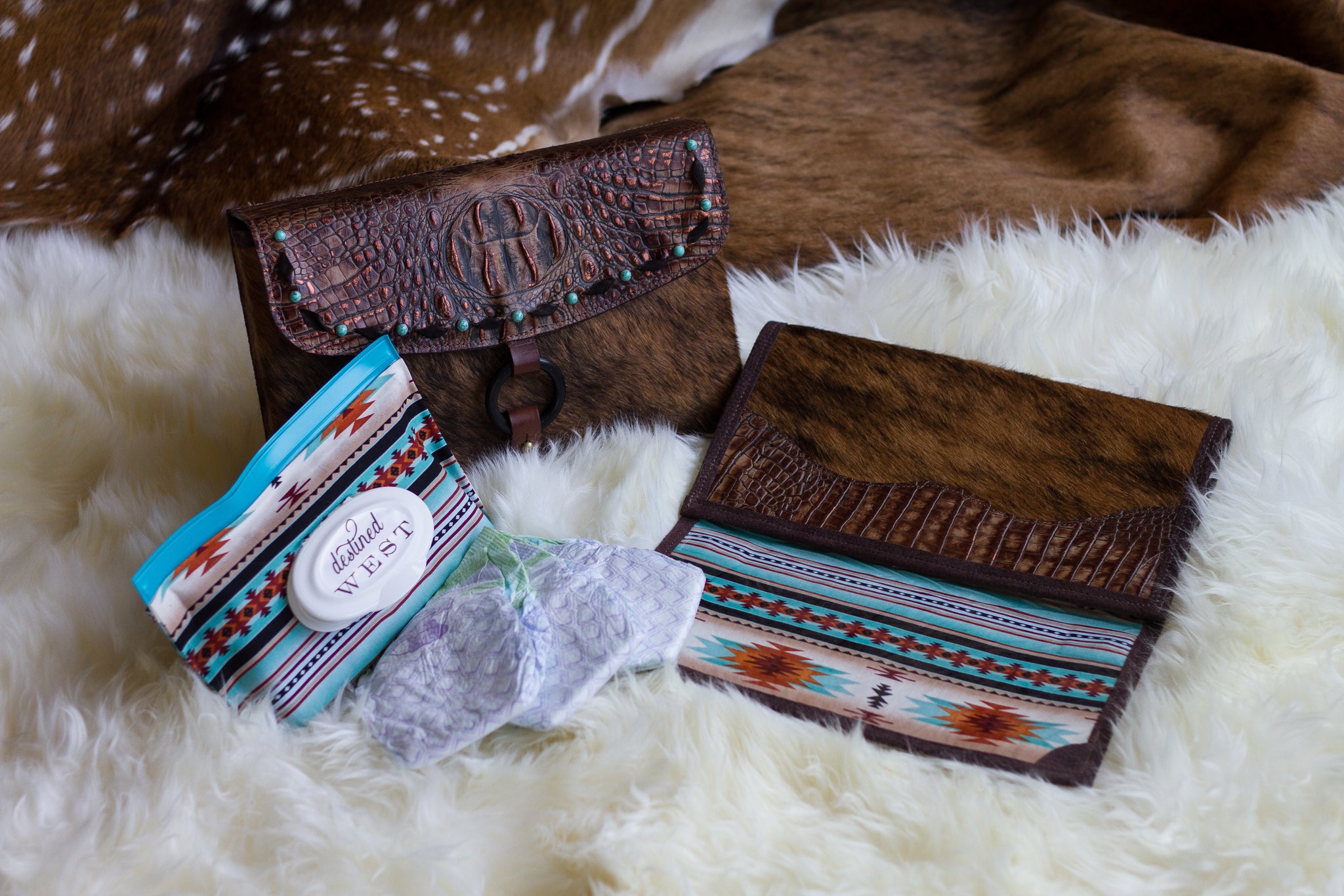 The Little Bear Peak Diaper Clutch is a distinctively handcrafted luxury diaper clutch of genuine leather and cowhide which embodies the lifestyle of the iconic West